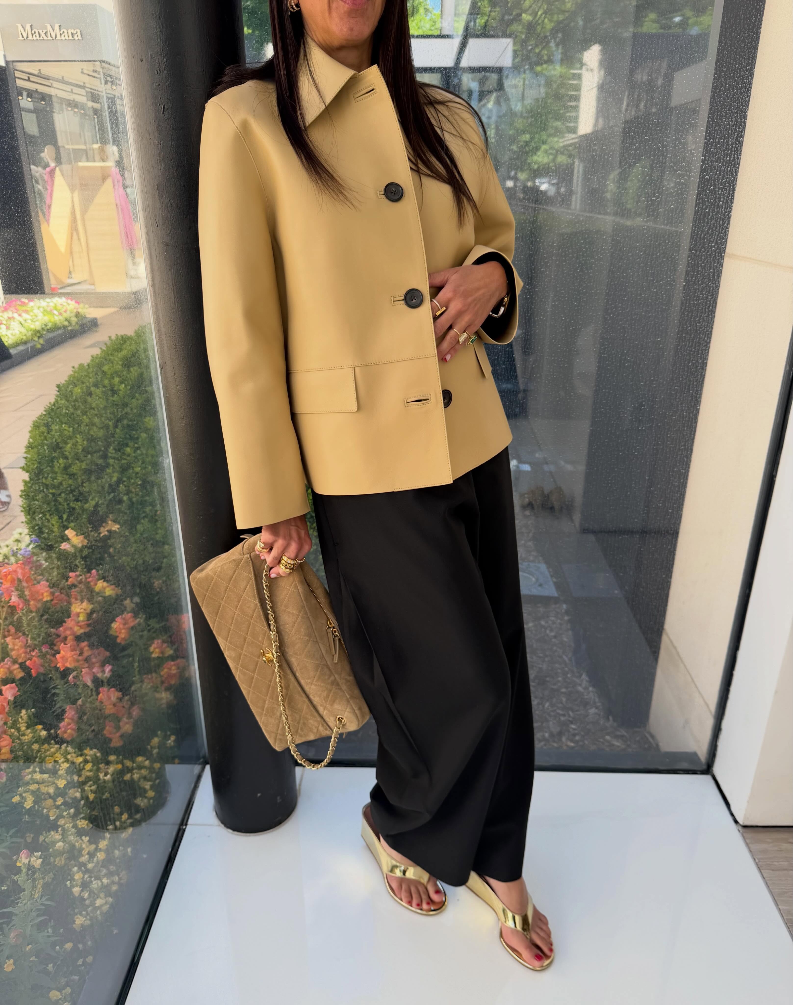 Marci Hirshleifer-Penn wearing gold flip-flops