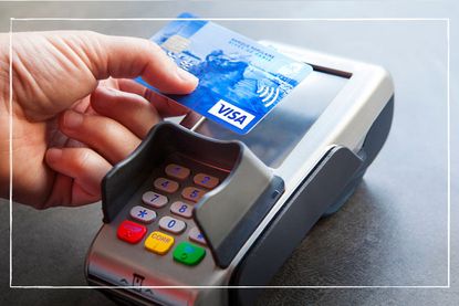 person making a contactless payment with a credit card