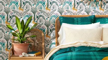 An animal-print peel and stick wallpaper next to a blue bed