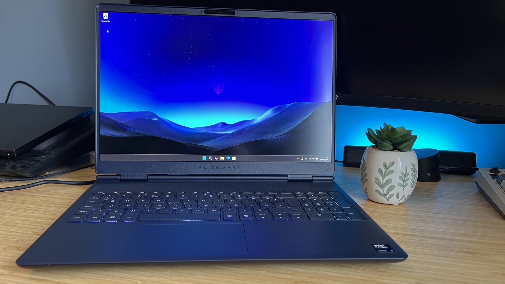 Alienware 16X Aurora gaming laptop on a wooden desk