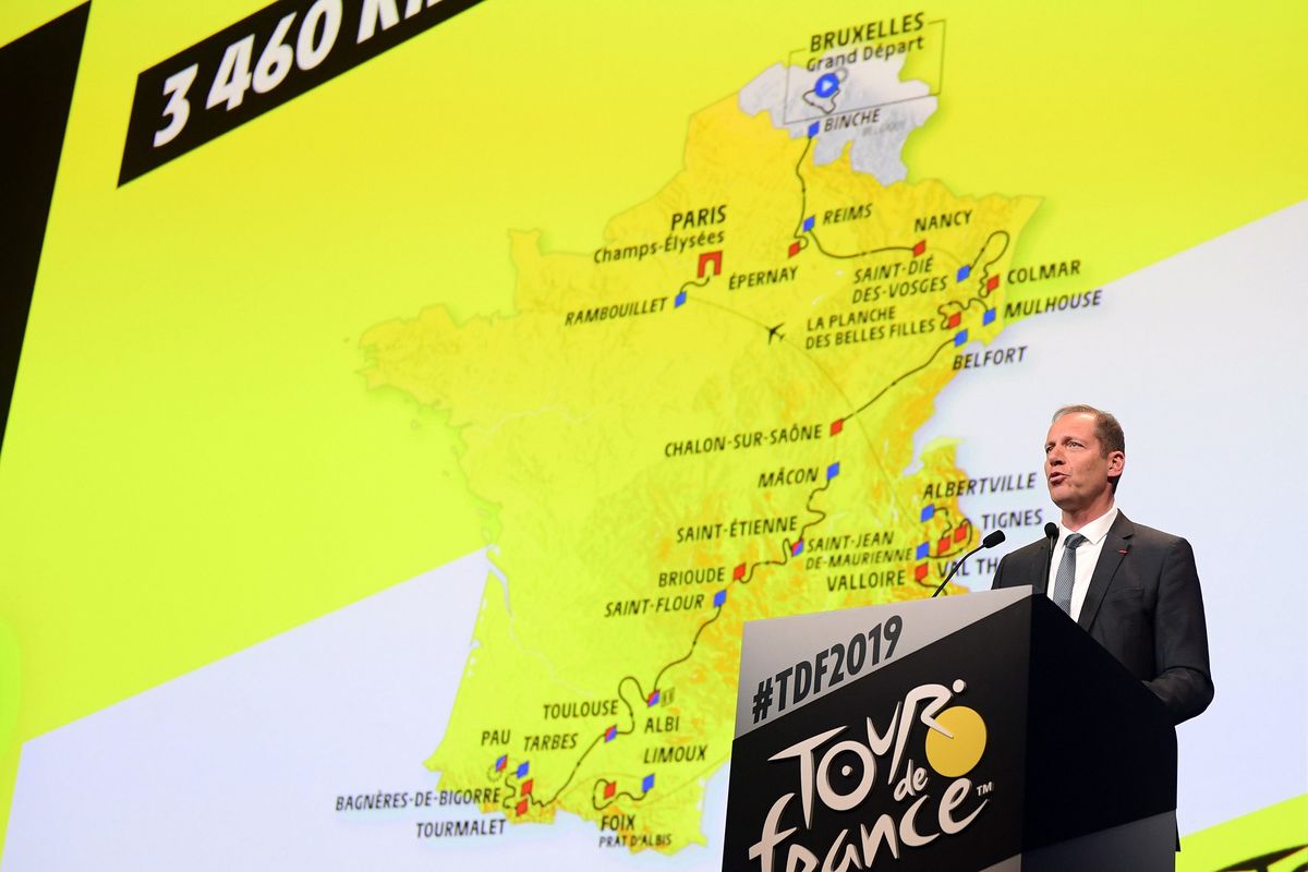 Tour de France race director Christian Prudhomme speaks below the map of the 2019 race route