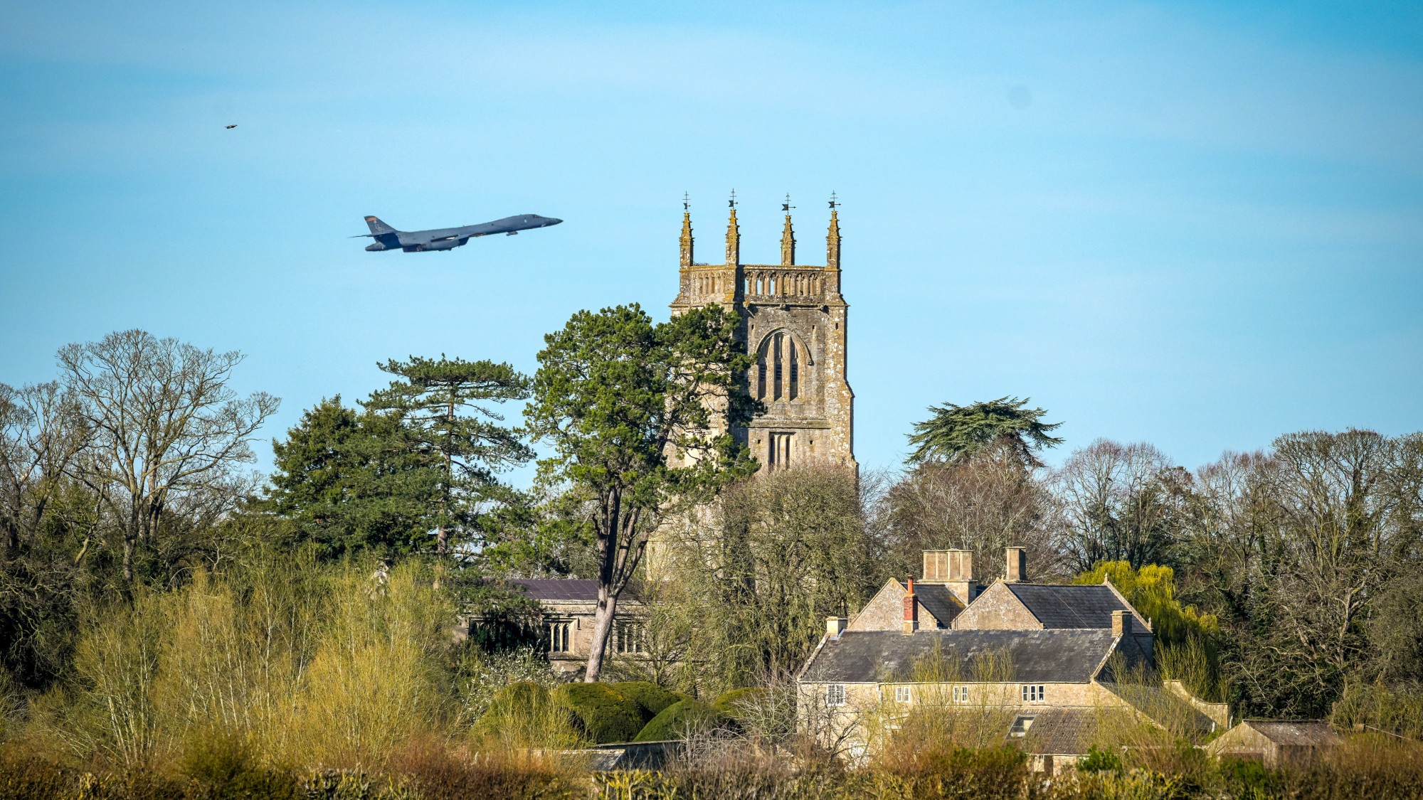 US fighter jet flying over a Cotswold village