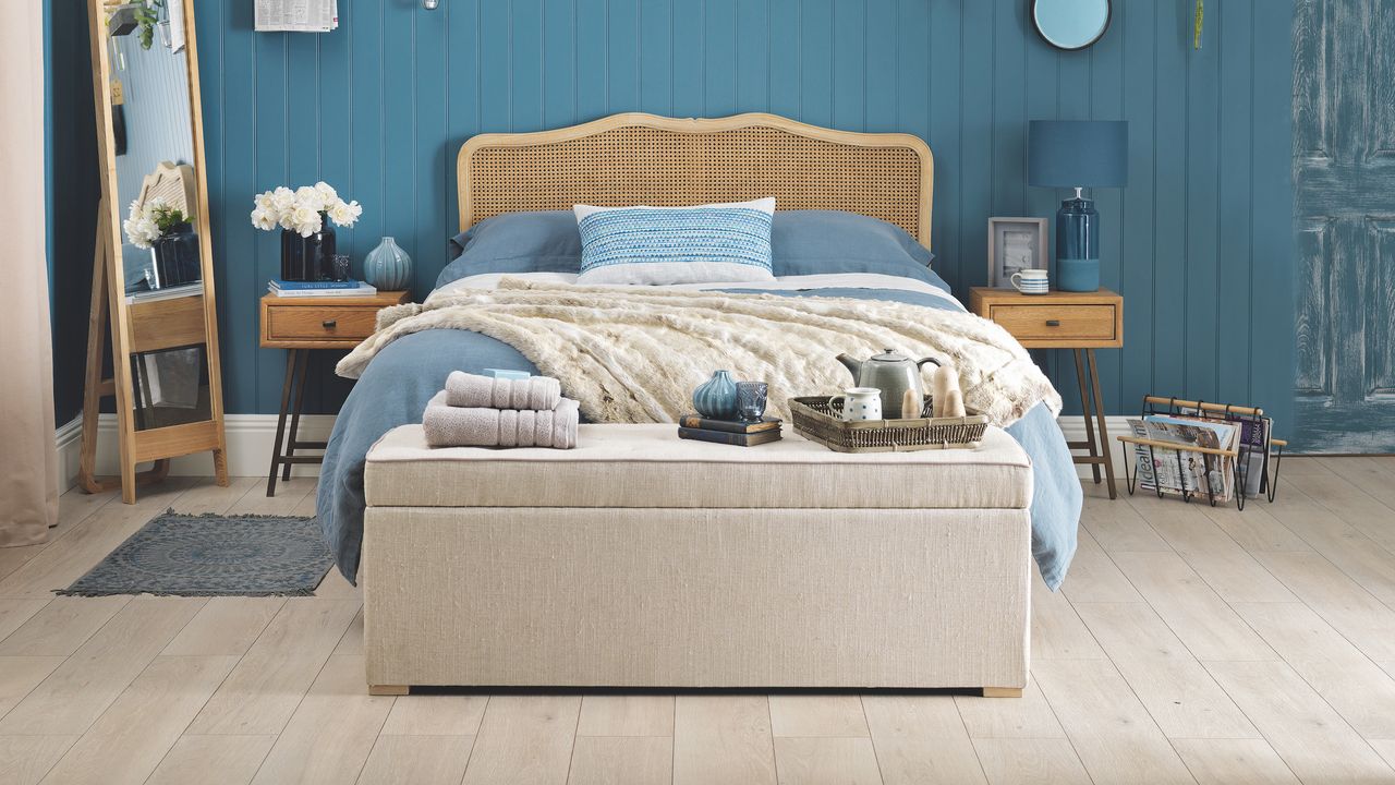 Blue bedroom with wooden bed