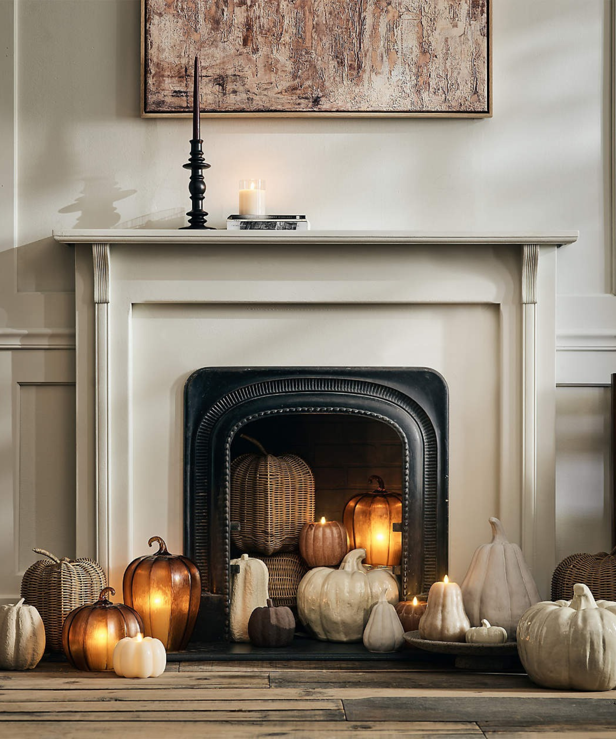 an assortment of pumpkins in a fireplace