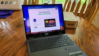 Acer Chromebook Spin 713 on table with Chromebook Perks landing page open
