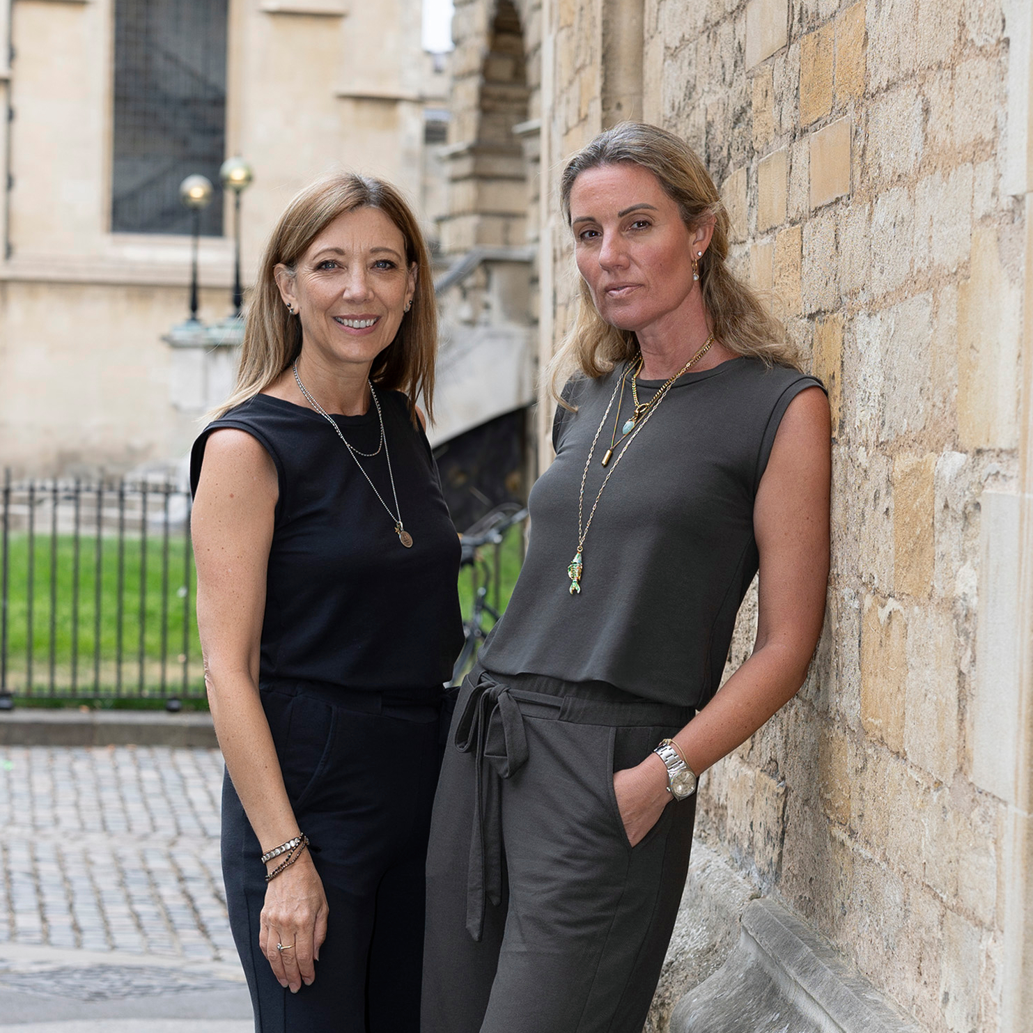 The founders of Weartwo stood against a wall