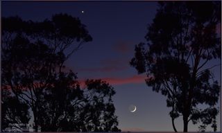 This image of the young crescent moon was taken by Michael Watson on Sept. 11, 2015, from the Barossa Valley, in Australia. The moon's disk is lit by earthshine, while bright Venus appears at the top.