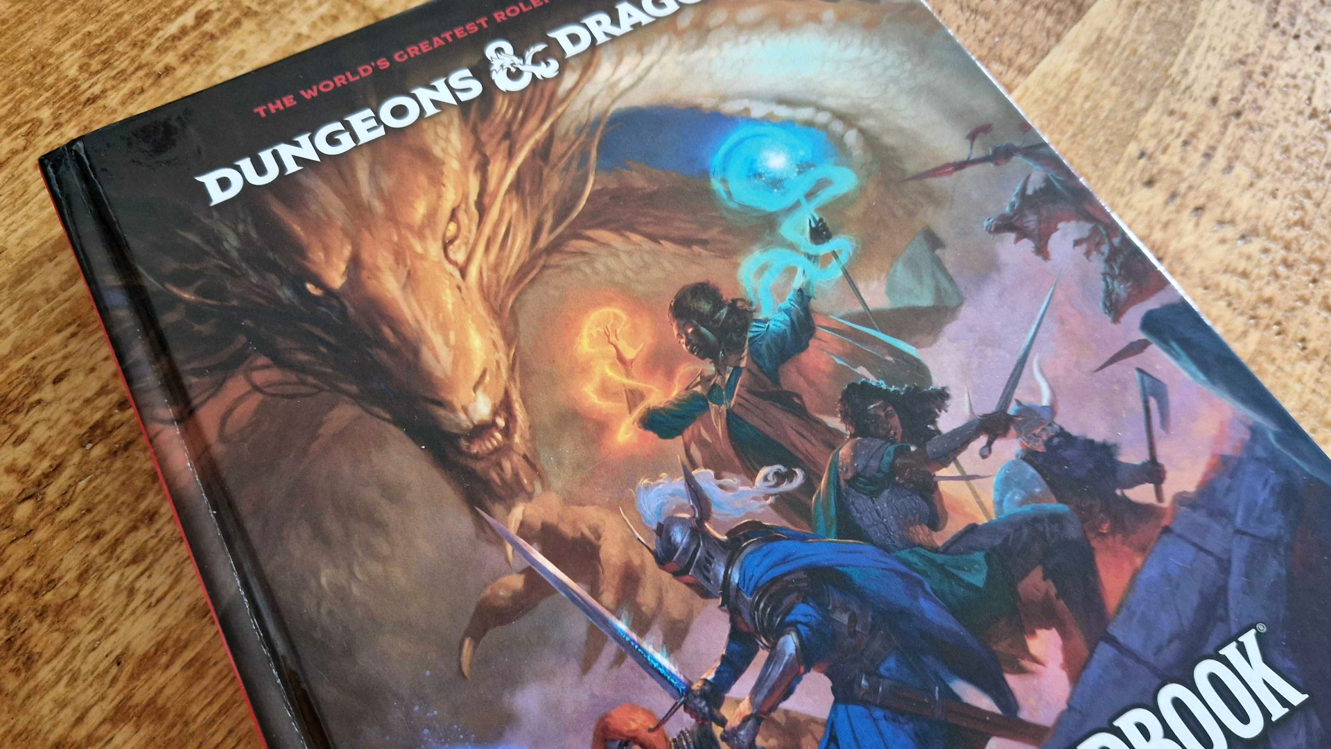 D&amp;D Player&#039;s Handbook laid out on a wooden surface