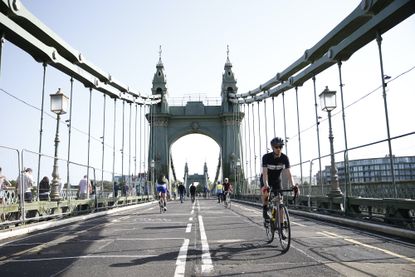 A cyclist on Hammersmith Bridge, London, in 2021