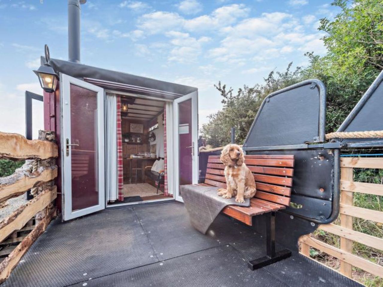 The bifold doors lead into the homes living room and a chair sits outside