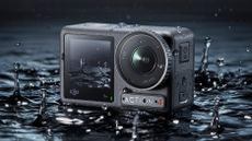 The DJI Osmo Action 4 action cam being splashed with water