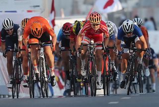 Amalie Dideriksen (Denmark) wins the bunch sprint for the rainbow jersey at the UCI Road World Championships in Doha Qatar