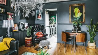 DIY Makeover living room with chandelier and leather chair