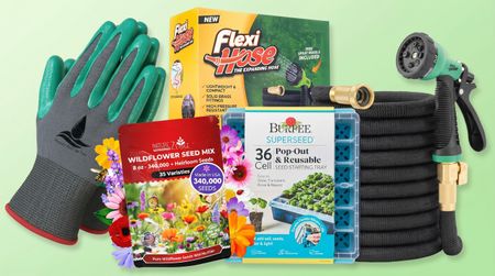 Gardening gloves, seeds, hose and seed starter trays on a green background.