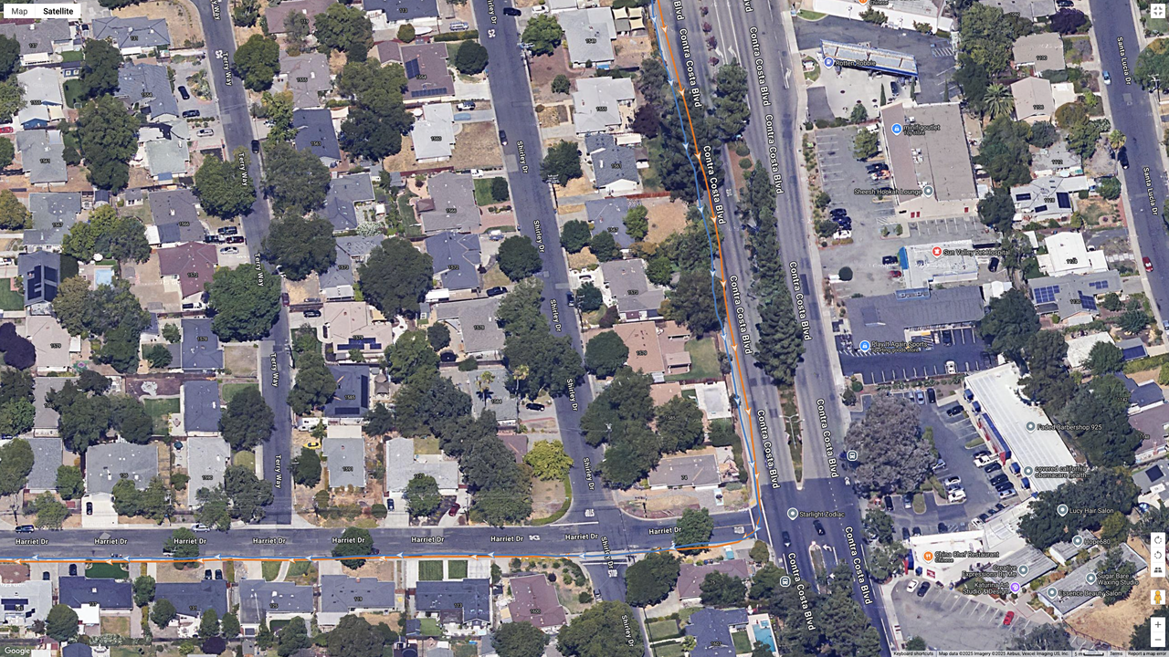 A Google Maps satellite image showing how the COROS PACE 4 (orange line) compares to the Garmin Forerunner 970 (blue line) for dual-frequency GPS accuracy for a suburban route.