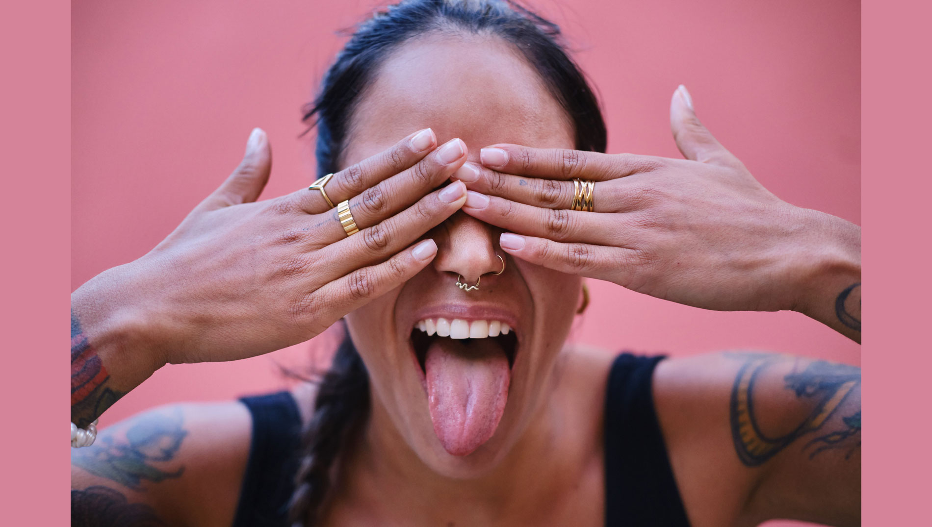 Woman with hands in front of face