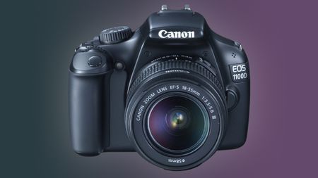 Canon EOS 1100D against a purple and dark green background