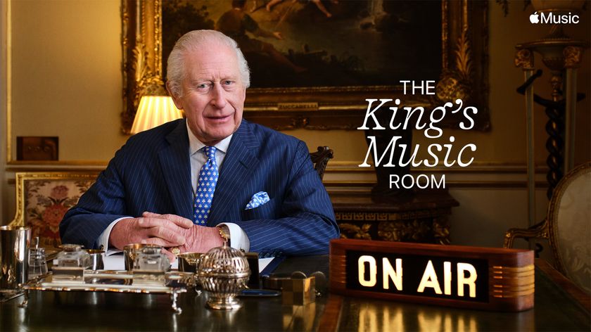 King Charles III sat at his desk in promo for his radio broadcast for Apple Music 1 