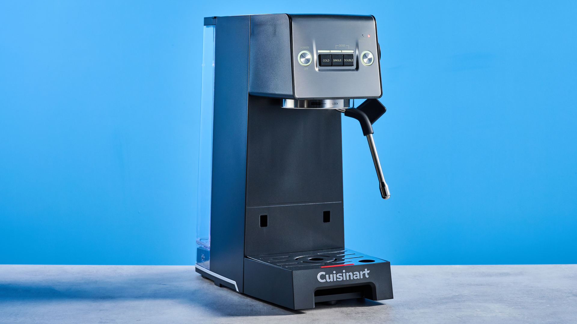 The Cuisinart Espresso Bar Slim espresso machine on a stone surface with a blue background