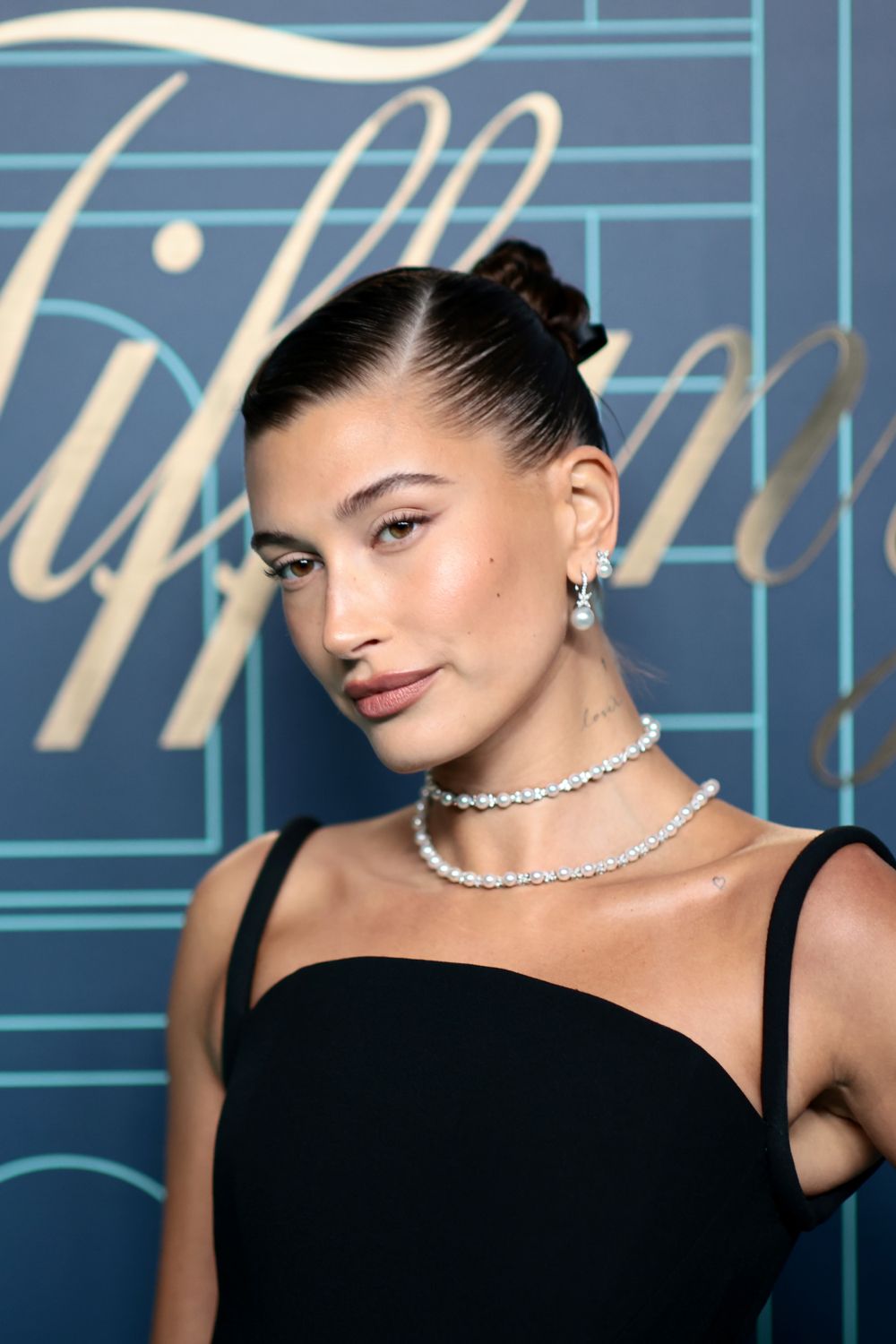 Meghan Markle bun: Hailey Bieber slicked back bun