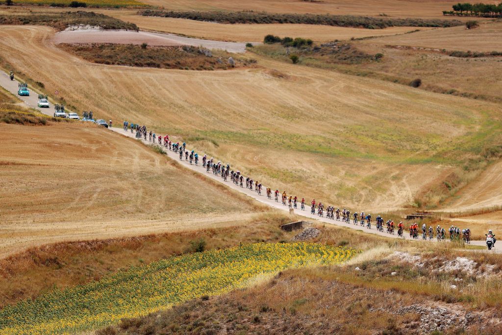 BURGOS SPAIN AUGUST 15 A general view of the peloton passing through a landscape during the 45th Vuelta a Burgos 2023 Stage 1 a 161km stage from Villalba de Duero to Burgos on August 15 2023 in Burgos Spain Photo by Gonzalo Arroyo MorenoGetty Images