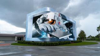 An astronaut comes out of an LED display at Kennedy Space Center. 
