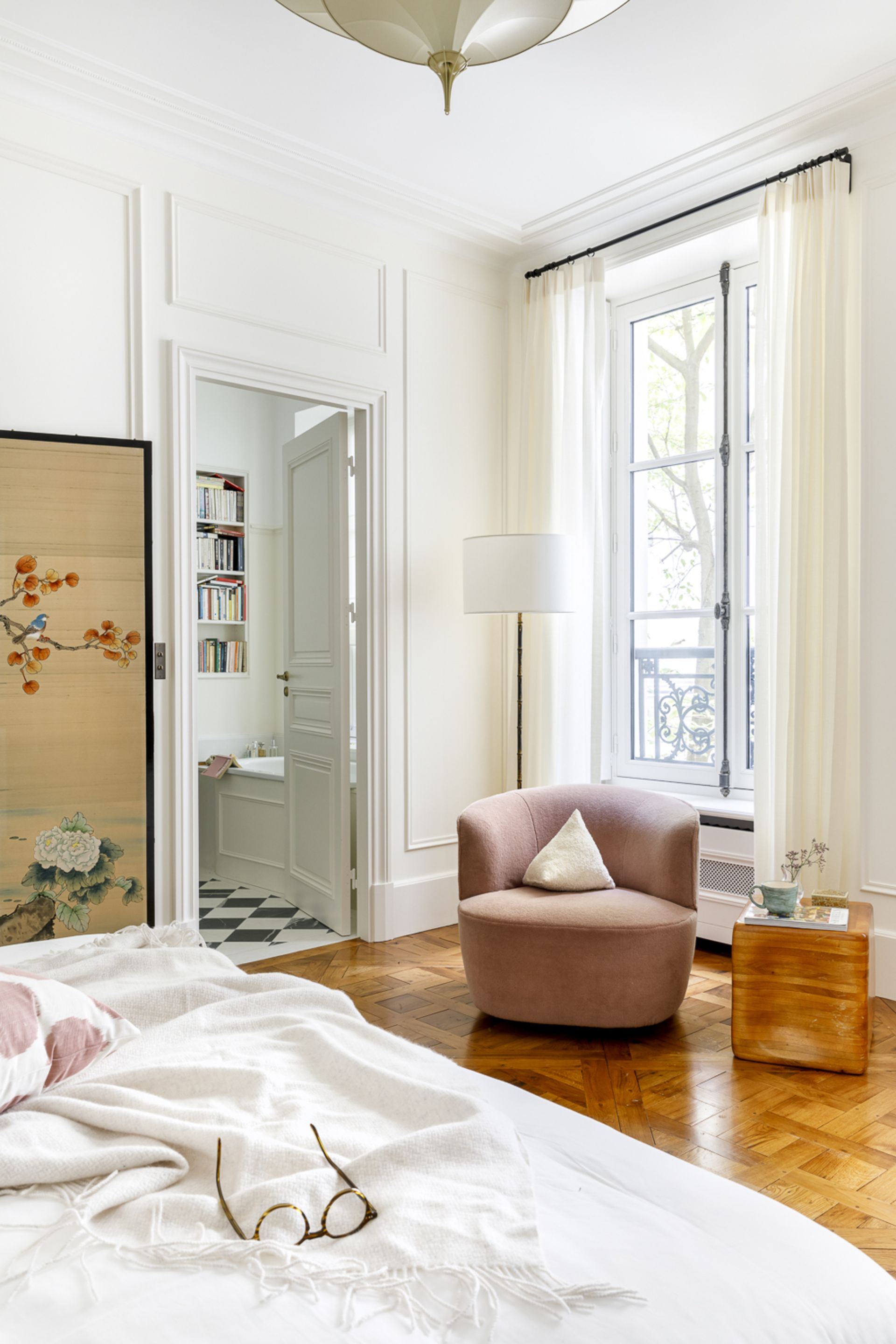 A cozy armchair in the corner of a room