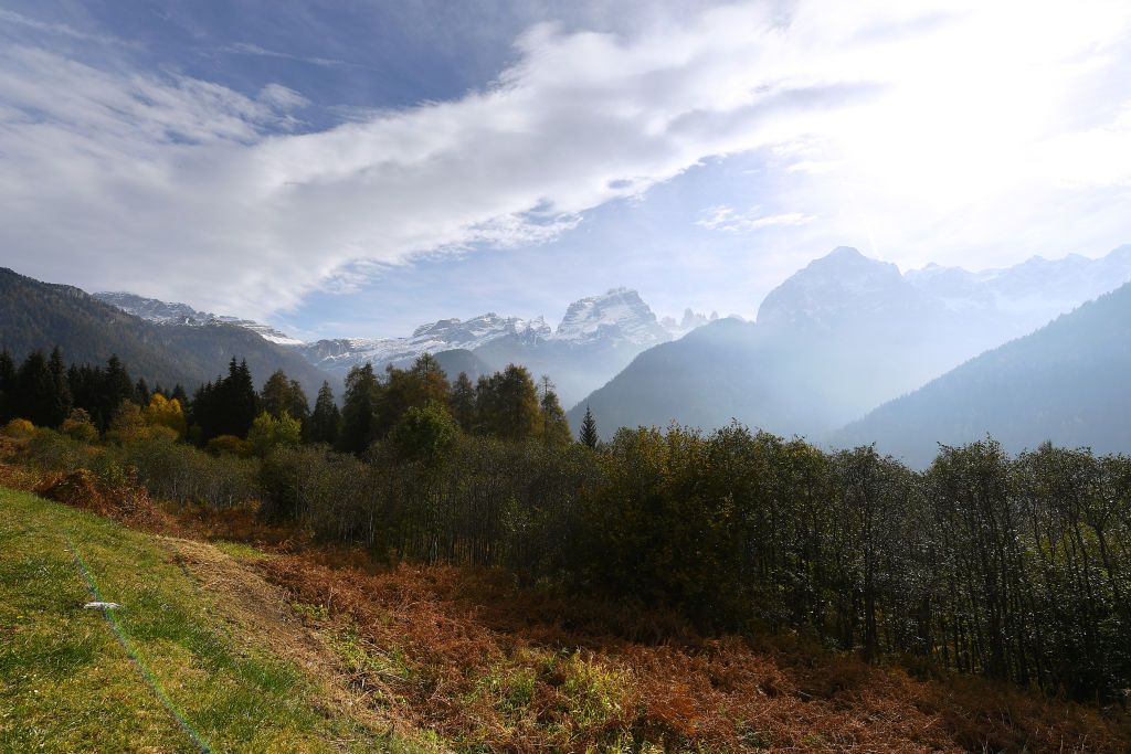 LAGHI DI CANCANO ITALY OCTOBER 22 Dolomites Southern Limestone Alps Val Rendena Autumn Forest Mountains Landscape during the 103rd Giro dItalia 2020 Stage 18 a 207km stage from Pinzolo to Laghi di Cancano Parco Nazionale dello Stelvio 1945m girodiitalia Giro on October 22 2020 in Laghi di Cancano Italy Photo by Stuart FranklinGetty Images