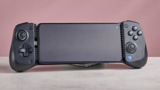 GameSir X5 Lite on white desk with pink wall in background