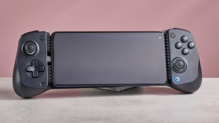 GameSir X5 Lite on white desk with pink wall in background