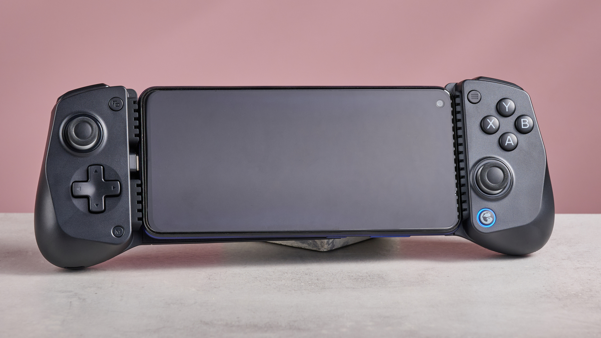 GameSir X5 Lite on white desk with pink wall in background