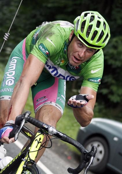 A battered Alessandro Petacchi (Lampre - Farnese Vini) is back on his bike after crashing heavily on the descent of the Stockeu.
