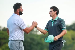 Jon Rahm and Joaquin Niemann shake hands