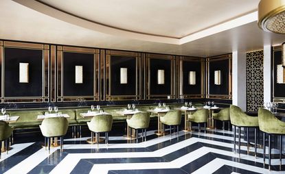 Dining room of the Song Qi restaurant in Monte Carlo with black and white floor and green seating