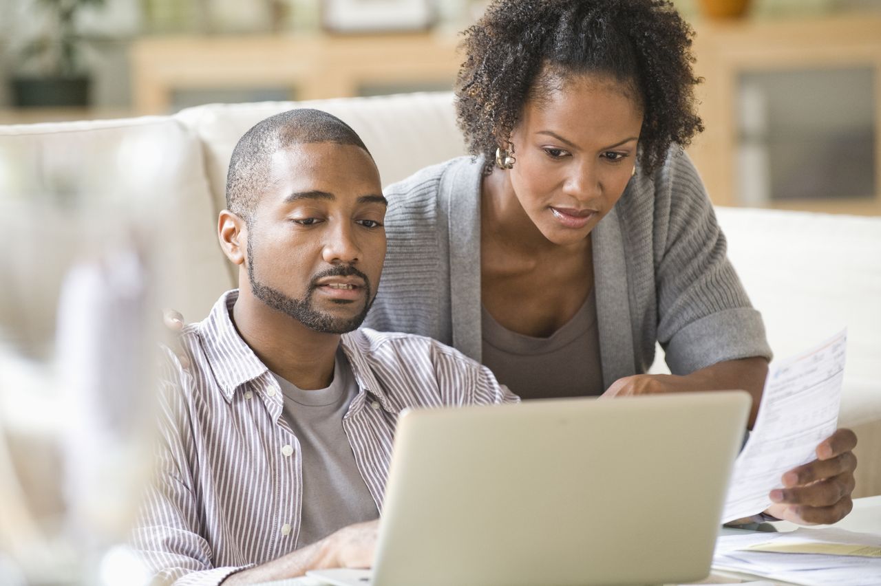 Couple looking at laptop