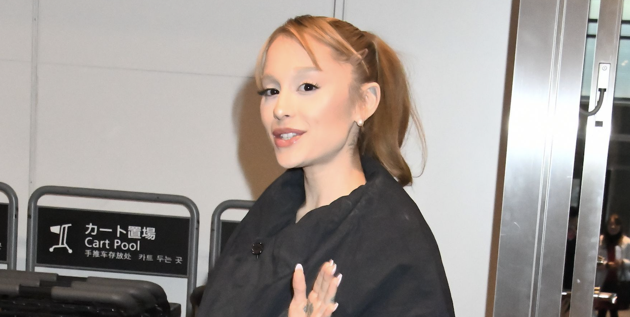 Actress/singer Ariana Grande is seen upon arrival at Haneda Airport on February 18, 2025 in Tokyo, Japan wearing a black puffer coat and lace tights