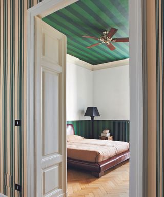 striped ceiling in a guest bedroom