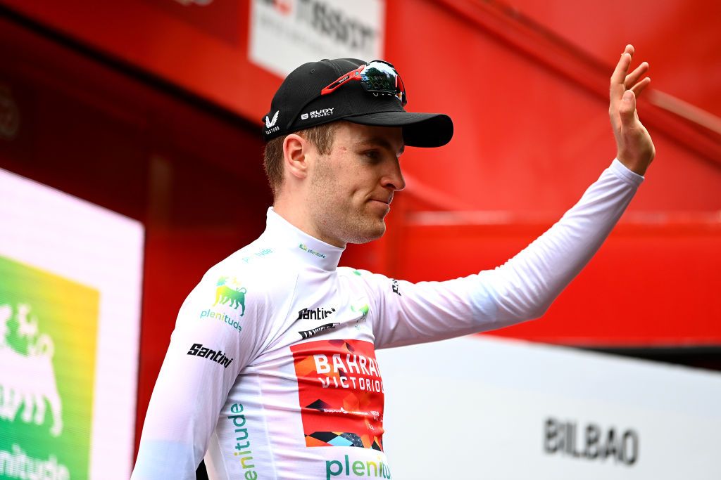 BILBAO SPAIN AUGUST 24 Fred Wright of United Kingdom and Team Bahrain Victorious celebrates winning the White Best Young Jersey on the podium ceremony after the 77th Tour of Spain 2022 Stage 5 a 1872km stage from Irn to Bilbao LaVuelta22 WorldTour on August 24 2022 in Bilbao Spain Photo by Tim de WaeleGetty Images