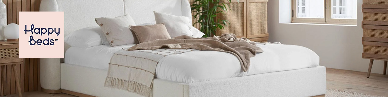 Happy Beds Logo placed over an image of a double bed