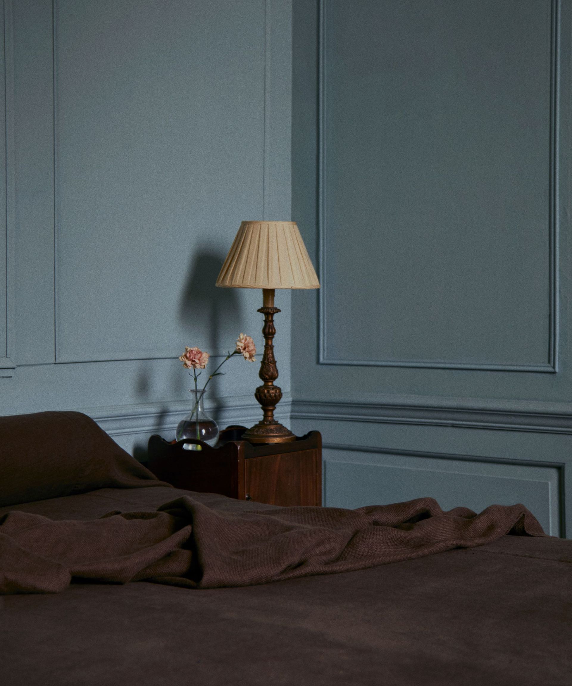 blue bedroom with dark brown bedding