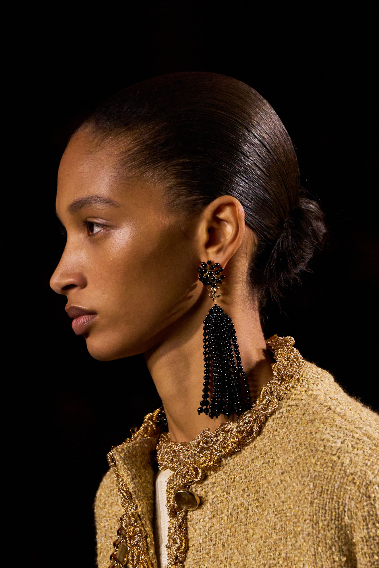 A model at the spring/summer 2026 show for Chanel wearing black beaded earrings.