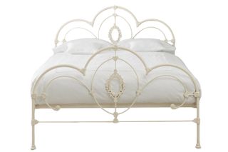 Metal Somerset Ivory king-sized bed with white bedlinen