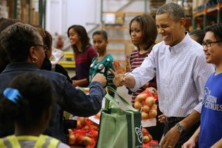 Barack and Michelle at the Capital Area Food Bank, November 2013