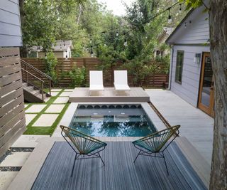 plunge pool with cover and loungers