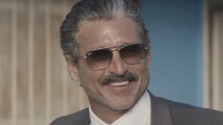 Patrick Dempsey as Aaron Spencer wearing aviators and a mustachioed smile in Dexter: Original Sin