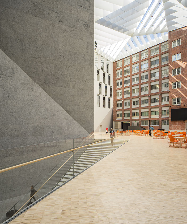 A view of a building outside with stairs going down