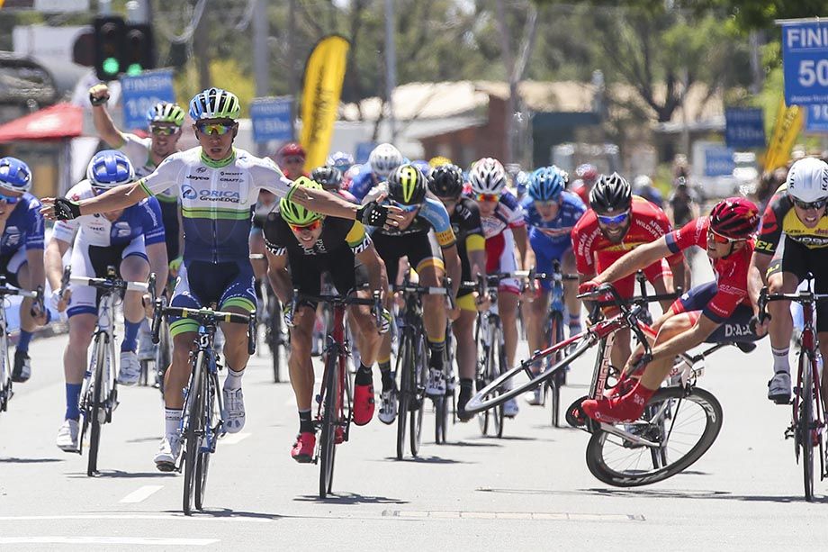 Caleb Ewan wins the stage in front of a crashing Brenton Jones