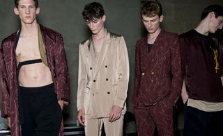 Male models wearing beige and burgundy suits from the Dries Van Noten SS2015 collection