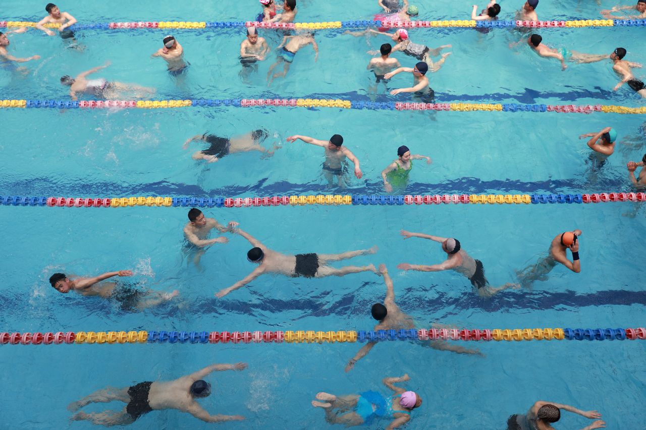 North Koreans swimming in a pool in the Munsu Water Park in Pyongyang.