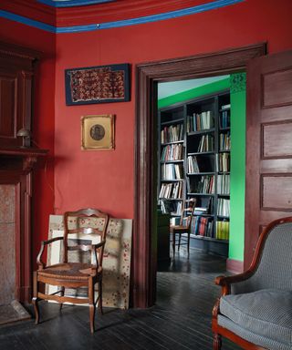 Wooden door, red walls, armchair
